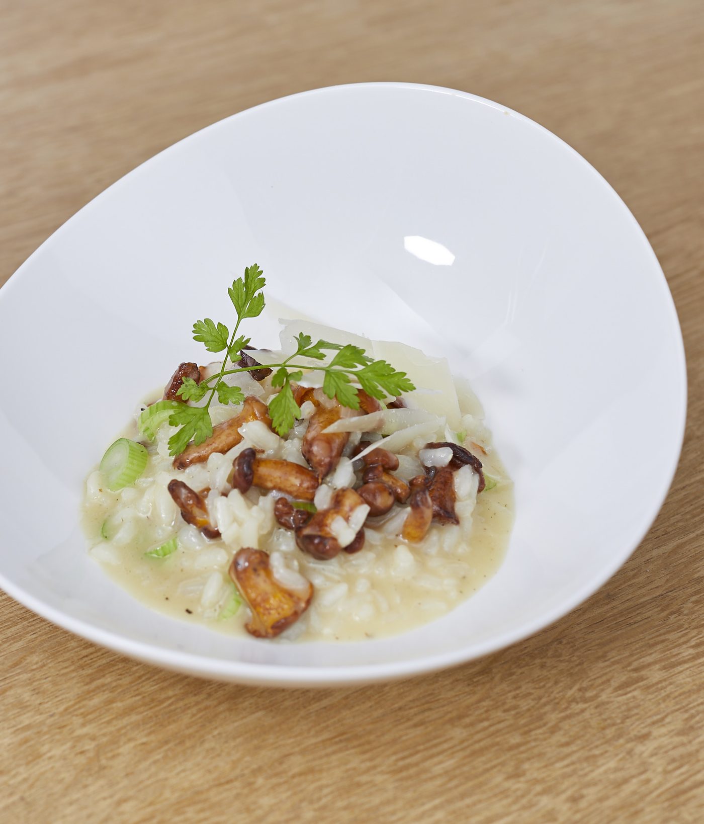 Mushroom risotto with chanterelles, plated for service